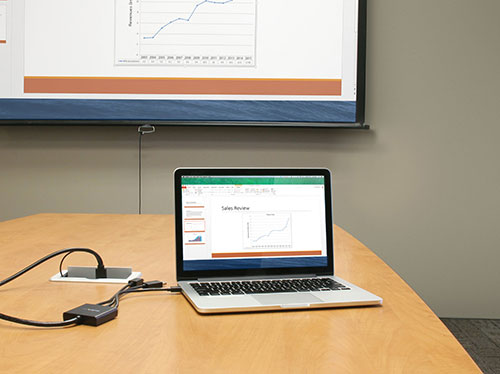 Delivering a presentation using the adapter to connect from a laptop to an HDMI projector