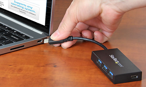 Palm-sized hub connecting to a Chromebook using the USB Type-C connector 