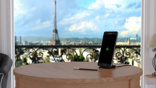 Charging a Samsung Galaxy Note 4 in a hotel room, with the Eiffel tower in the background