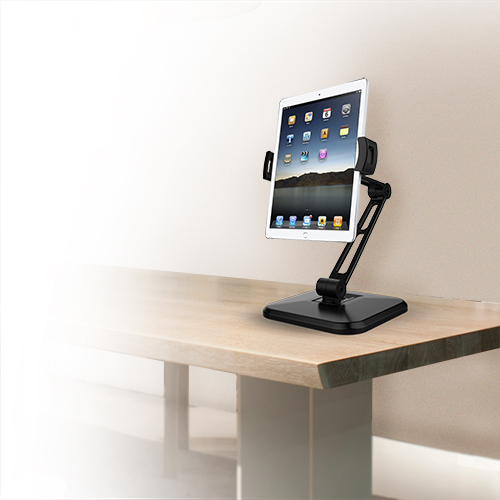 A tablet mounted on the tablet desk stand