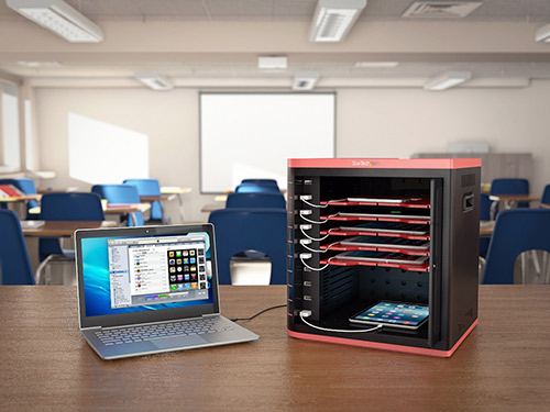 Image of charge and sync cabinet deployed in classroom setting while syncing with a laptop